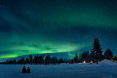 Watching a night sky with aurora borealis