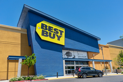 Best Buy consumer electronics company store entrance, facade and exterior with customer car parked in front - Mountain View,California, USA - 2021