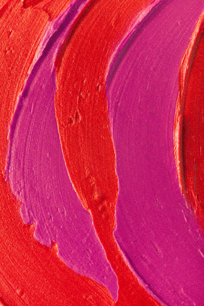 istock Smudged vibrant red purple scarlet pink claret maroon textured lipstick solid background 1312345532