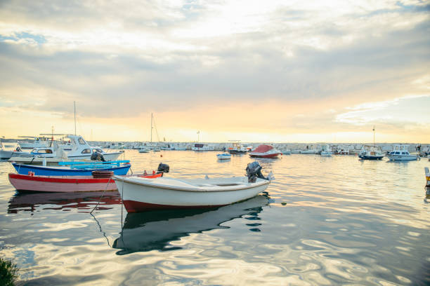 istock view of boats in dock at sunset. 1312345666