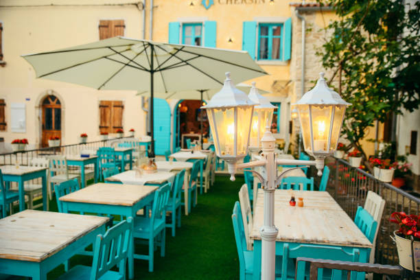 istock view of beautiful outdoors restaurant with sun umbrellas 1312345684