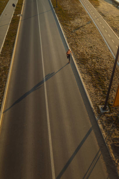 istock Jogging on the city road 1312346909
