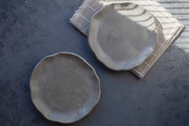istock Pile set of Stone curl color platter on gray conrete table 1312348964
