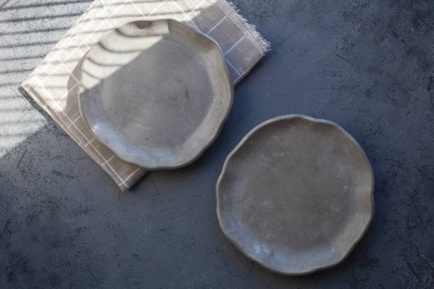 istock Pile set of Stone curl color platter on gray conrete table 1312348966