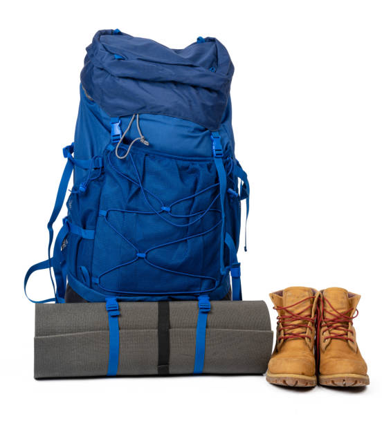istock Blue hiking backpack with fitness mat isolated on white 1312349206