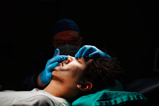 man meeting with plastic surgeon before operation in clinic - nose job imagens e fotografias de stock