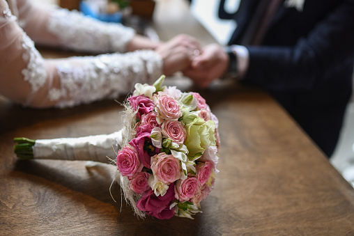 Bridal bouquet on rustic wooden table