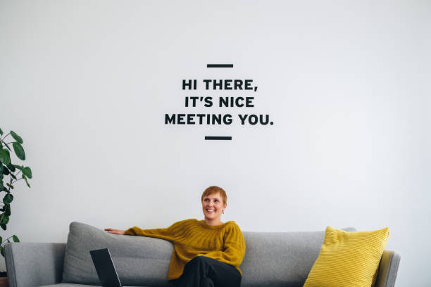 istock Smiling businesswoman on sofa in lobby 1312351924
