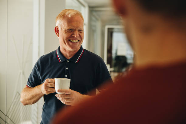 istock Business people having a coffee break at work 1312351997