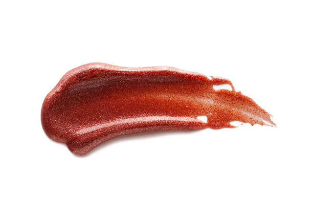 istock Smudged vibrant deep chocolate brown purple maroon textured lip balm on white isolated background 1312352014