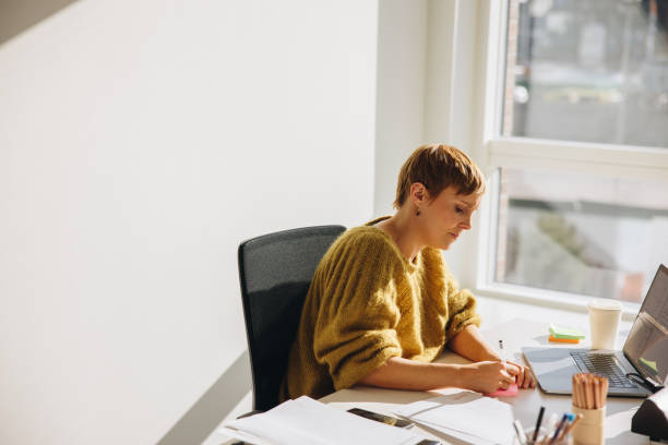 istock Woman working at her office desk 1312352108