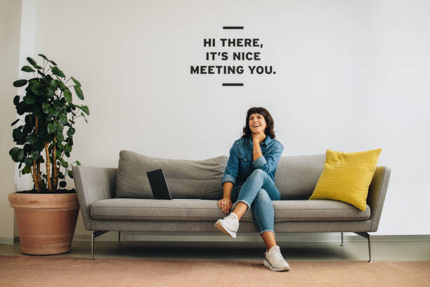 istock Cheerful entrepreneur sitting at lobby 1312352712