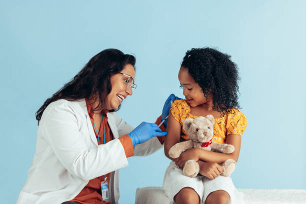 istock Girl getting flu shot 1312355484