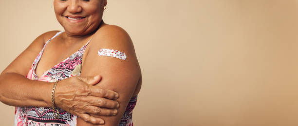 istock Senior female getting a vaccine 1312355509