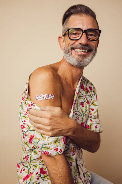 istock Mature man smiling after getting vaccine 1312355586
