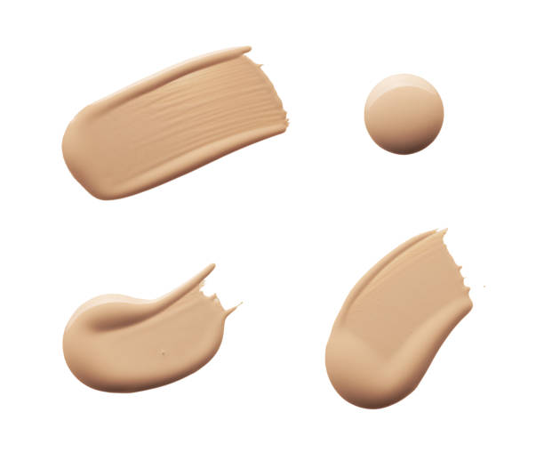 Smudged make-up gradient texture palette creamy matte beige concealer foundation CC or BB-cream powder on white isolated background