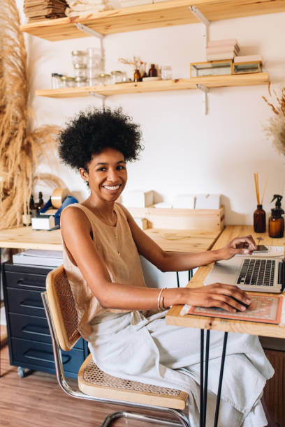 istock Smiling woman accessories designer in studio 1312357858