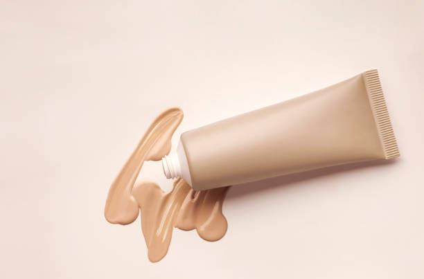 Smudged make-up gradient texture palette creamy matte beige concealer foundation CC or BB-cream powder on white isolated background