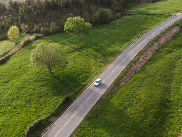 istock Car on a countryside road as seen from above 1312358277