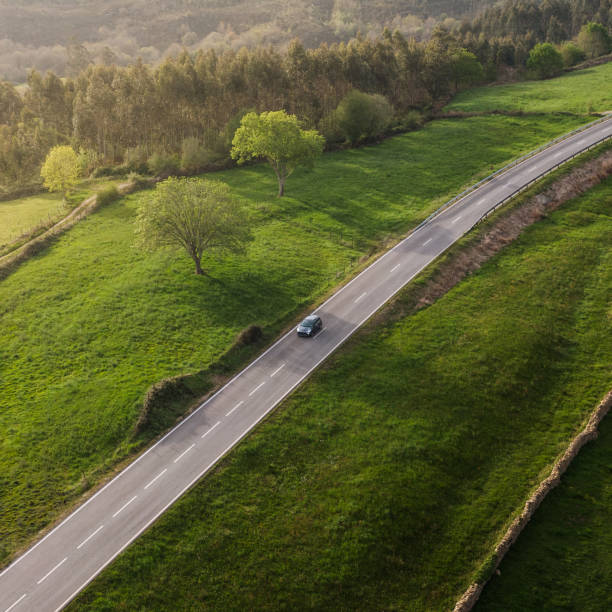 istock Car on a countryside road as seen from above 1312358280