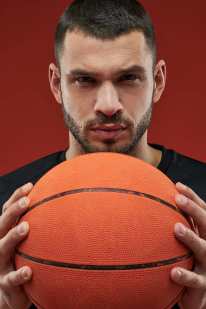 istock Thoughtful seriously sportsman posing at the camera 1312359555