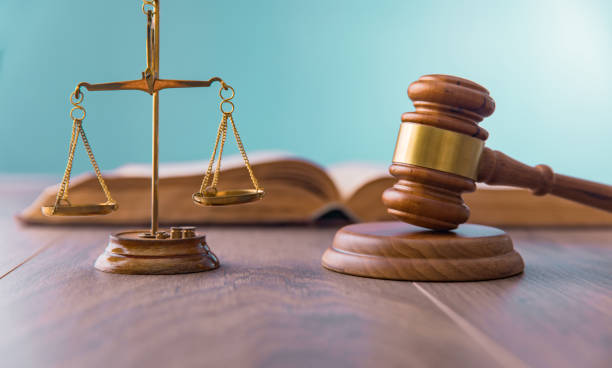 istock scales with judge gavel and law book 1312362117