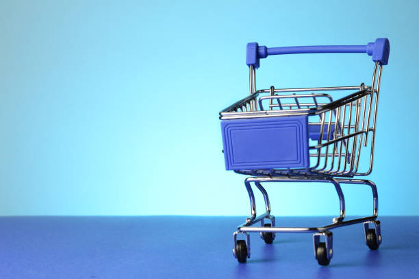 istock Shopping Cart Over Blue 1312363330