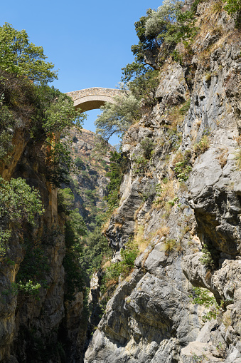 the Devil Bridge over the Raganello river in Civita. Beautiful mountain landscape of the Pollino National Park is protected area and the largest outdoors park in Italy, Calabria