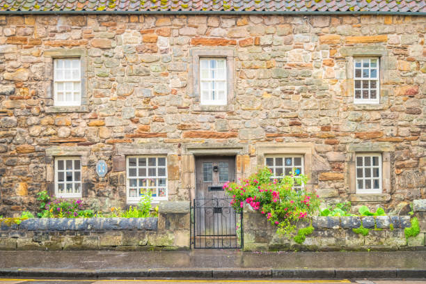 Seventeenth-century fishing cottage, now housing the St Andrews Preservation Trust Museum, in downtown St Andrews, Scotland on a cloudy day.
