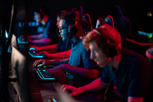 Professional esports players at an online game tournament. The cyber team plays computers and trains stock photo