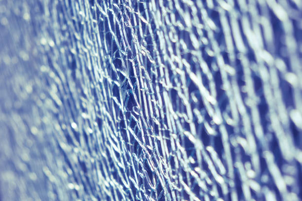 istock Background of cracks on broken glass in blue color, texture 1312369893