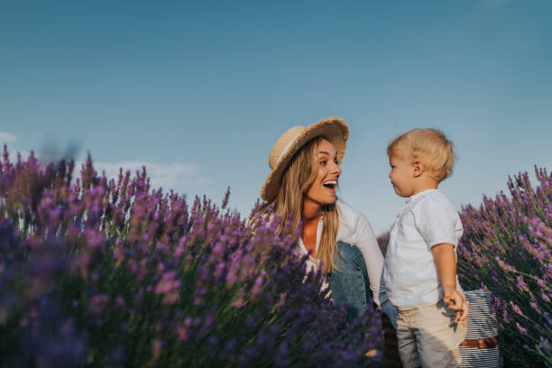 istock Little boy and his mother having fun at lavender field 1312370889