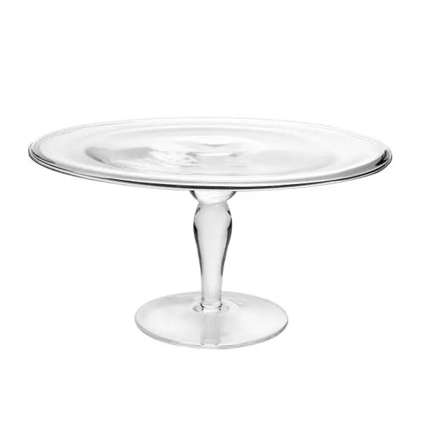 Photo of Glass cake stand on white table isolated on white background