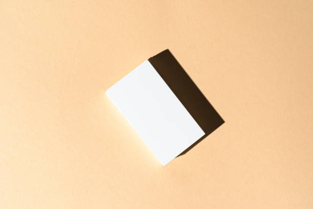 istock Stack of businesscards with copy space on beige background 1312378253