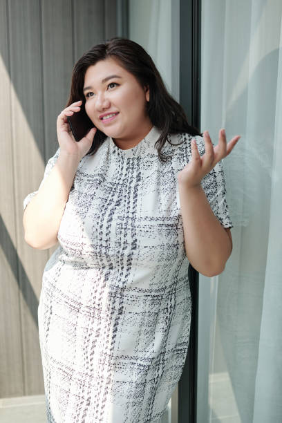 istock Emotional woman talking on phone 1312385931