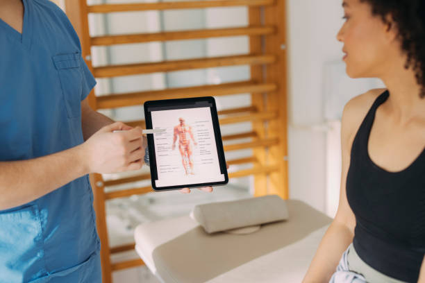 istock Physical Therapist and Young Woman Having a Conversation While the Therapist is Explaining Something on a Tablet 1312385958