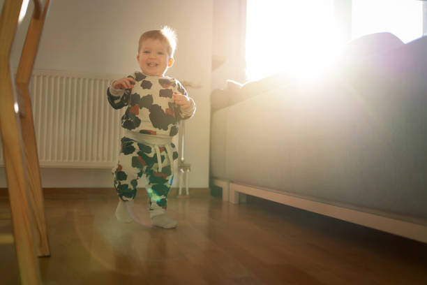 istock Happy baby boy making first independent steps 1312386303