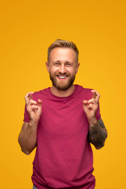 istock Happy hipster man with crossed fingers 1312386377