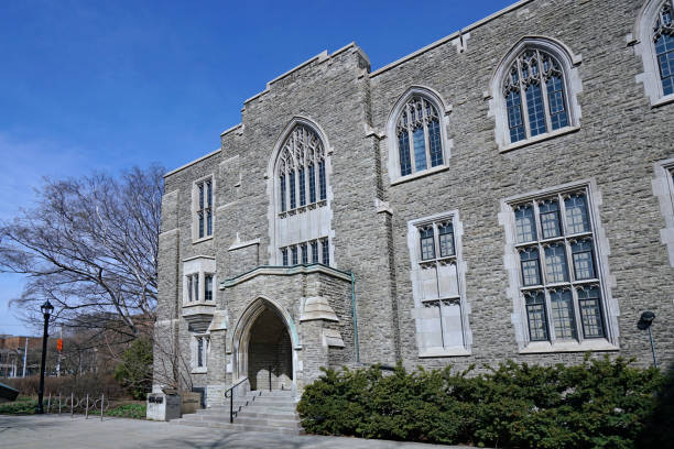 istock Gothic style stone college building with leaded glass windows 1312395286