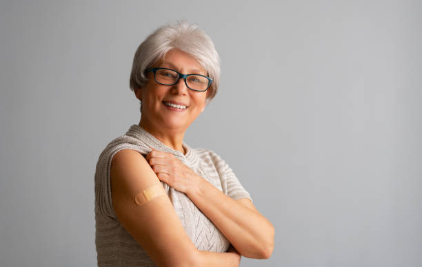 Senior woman after vaccination. stock photo