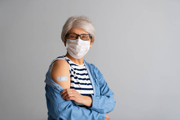 istock Senior woman after vaccination. 1312395340