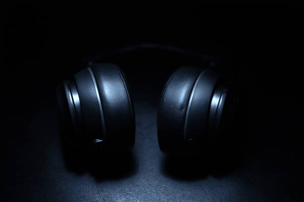 istock Wireless Headphone In The Dark Ambiance 1312397550