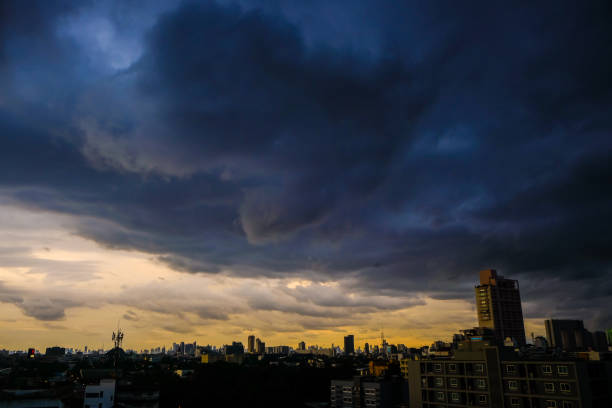 istock Before big rainy cloud sunset sky with city building 1312398545