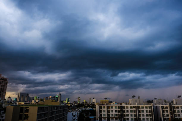 istock Before big rainy cloud sunset sky with city building 1312398577