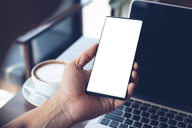istock Mockup of man using smartphone in cafe 1312400768