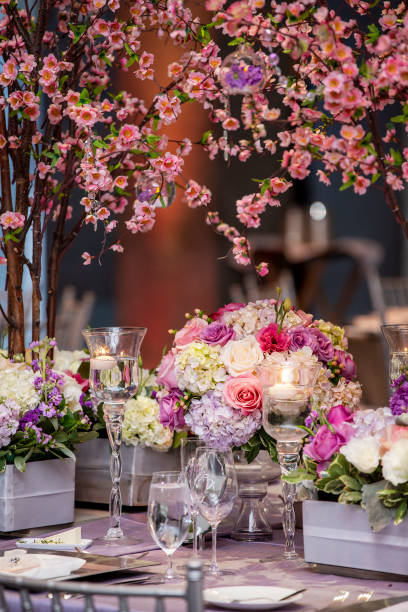 istock Indoor dinner setting for a wedding ceremony event with flowers and candles 1312402409