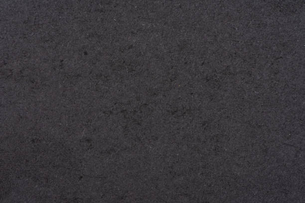 istock Textured blank black sheet of cardboard or paper. Background 1312403919