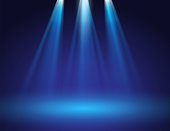 istock blue stage spotlights 1312403920
