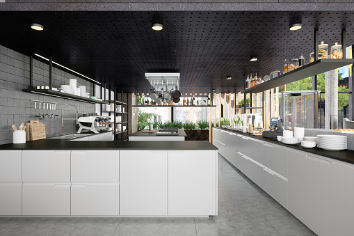 Restaurant Kitchen With White Cabinets, Kitchen Island And Kitchen Utensils