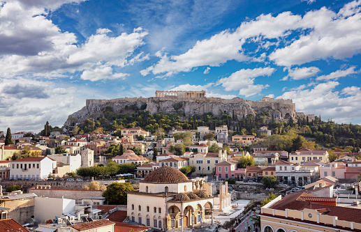 Athens, Greece. Monastiraki square. Aerial panoramic view of the city and Acropolis rock. Cloudy blue sky background